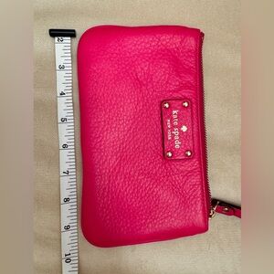 Kate Spade fuchsia color. Pebbled leather